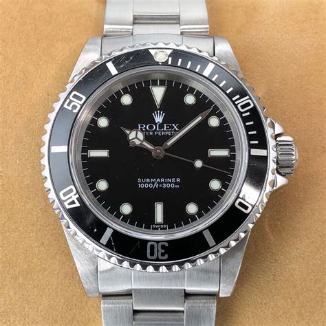 rolex submariner 14060m 2 lignes|rolex 14060 swiss only dial.